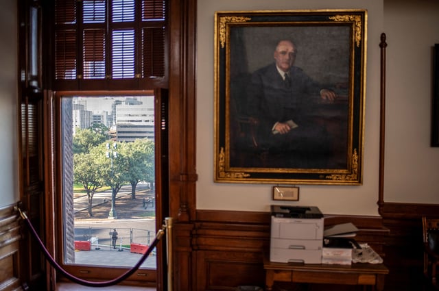 A member of the Texas Department of Public Safety stands outside the Texas State Capitol building in Austin, Texas, on August 13, 2025.