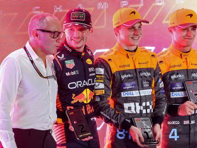 (From L-R) Formula One CEO Stefano Domenicali, Red Bull Racing's Dutch driver Max Verstappen, McLaren's Australian driver Oscar Piastri,  and McLaren's British driver Lando Norris pose for a picture after the sprint race ahead of the Qatari Formula One Grand Prix at the Lusail International Circuit on October 7, 2023. (Photo by Giuseppe CACACE / AFP)