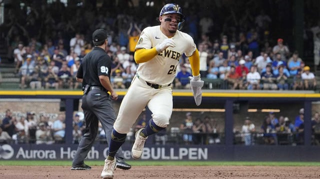 Aug 13, 2025; Milwaukee, Wisconsin, USA; Milwaukee Brewers catcher William Contreras (24) scores from second base agasint the Pittsburgh Pirates in the fourth inning at American Family Field. Mandatory Credit: Michael McLoone-Imagn Images