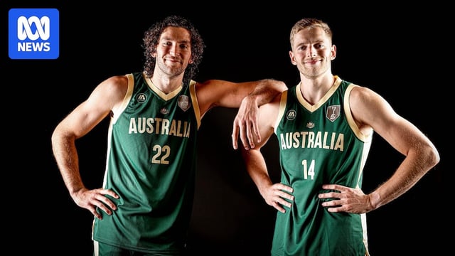 Promotional picture of two Boomers players, Will Magnay and Jack White, smiling as they stand together.