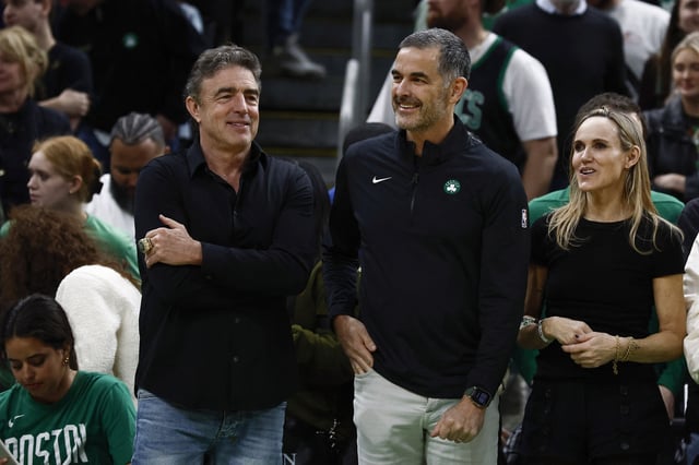 Apr 4, 2025; Boston, Massachusetts, USA; Bill Chisholm, center, who leads a group that is buying the Boston Celtics, stands with current owner Wyc Grousbeck and Chisholm’s wife, Kimberly Chisholm before the game between the Boston Celtics and the Phoenix Suns at TD Garden. Mandatory Credit: Winslow Townson-Imagn Images/File Photo