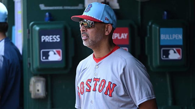 Jul 4, 2025; Washington, District of Columbia, USA; Boston Red Sox manager Alex Cora (13) stands in the dugout during the eighth inning of a game against the Washington Nationals at Nationals Park. Mandatory Credit: Rafael Suanes-Imagn Images