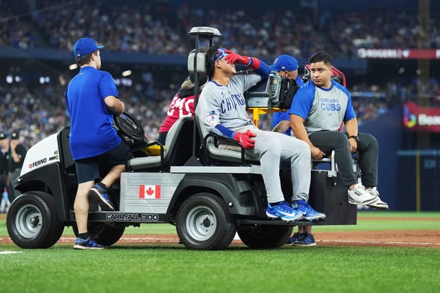 Cubs catcher Miguel Amaya leaves the game with a left leg injury during eighth inning against the Blue Jays on Wednesday, Aug. 13, 2025, in Toronto. (Nathan Denette/The Canadian Press via AP)