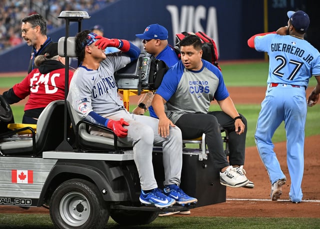 Aug 13, 2025; Toronto, Ontario, CAN;  Chicago Cubs catcher Miguel Amaya (9) is taken from the game on a cart after injuring his ankle at first base in the eighth inning against the Toronto Blue Jays at Rogers Centre. Mandatory Credit: Dan Hamilton-Imagn Images