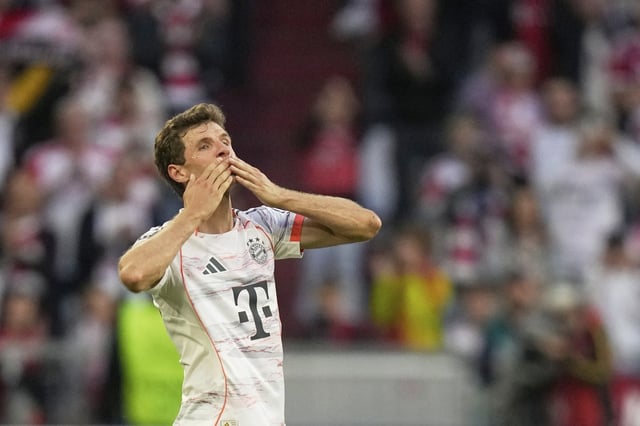 Bayern's Thomas Mueller greets supporters after being substituted during the German Bundesliga soccer match between FC Bayern Munich and Borussia Moenchengladbach in Munich, Germany, Saturday, May 10, 2025. (AP Photo/Matthias Schrader)