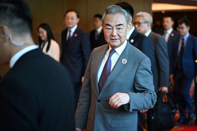 China's Foreign Minister Wang Yi walks between meetings during the 58th ASEAN Foreign Ministers' meeting and related meetings at the Convention Centre in Kuala Lumpur on July 11, 2025.     MANDEL NGAN/Pool via REUTERS/File Photo