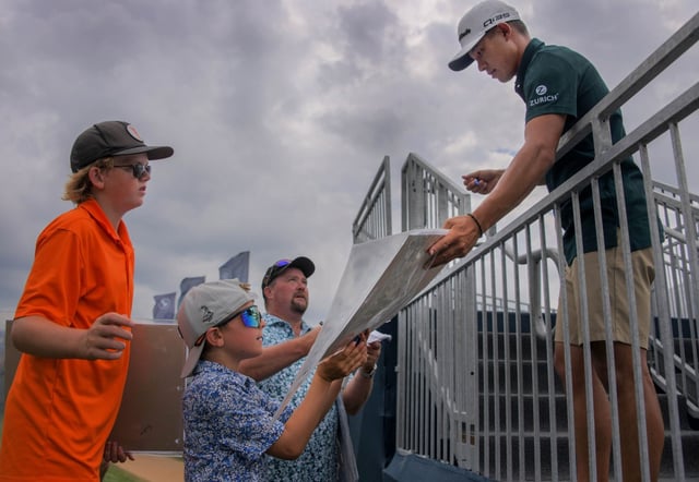 Ranked seventh in the PGA Tour, golfer Colin Morikawa signs memorabilia for Aiden Moorhouse, 9 of Centerville, below and Evan Hill, 11 of Easton, who both play with the PGA Junio League, Under Armour Junior Tour and US Kids Golf during the BMW Charity Pro-Am, which gets underway at Caves Valley Golf Club. (Karl Merton Ferron/Staff)