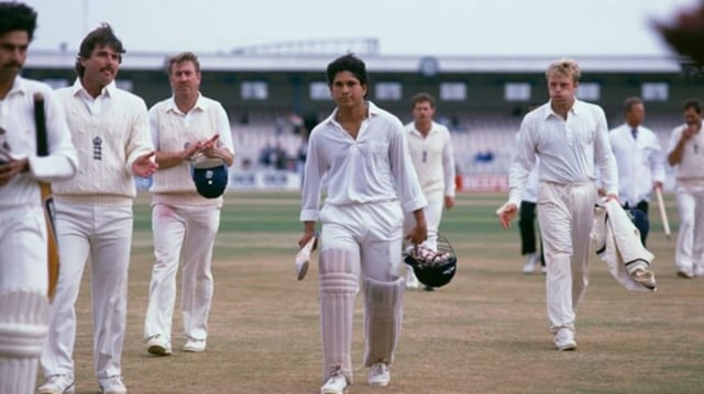 Sachin Tendulkar walks out of Old Trafford after scoring his maiden Test century to rescue the match for India.