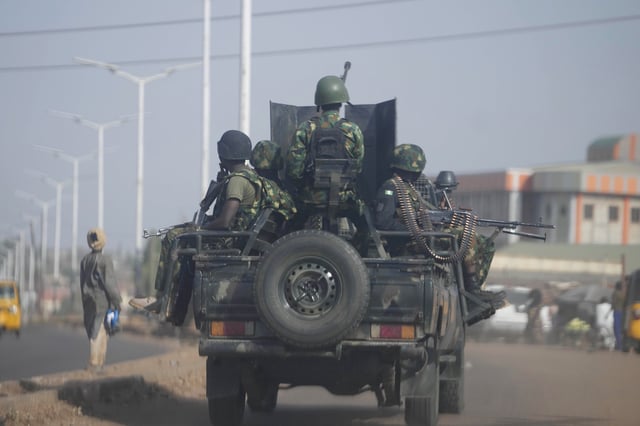 FILE - Nigeria army patrols along the Kaduna Birnin Gwari area in Nigeria, Friday, March 8, 2024. (AP Photo/Sunday Alamba, File)
