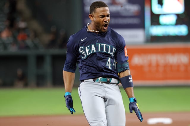 Seattle Mariners outfielder Julio Rodriguez celebrates after hitting a triple during the seventh inning against the Baltimore Orioles.