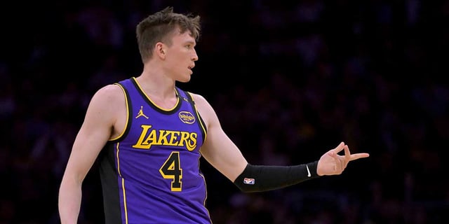 Apr 4, 2025; Los Angeles, California, USA; Los Angeles Lakers guard Dalton Knecht (4) reacts after a 3-point basket in the first half against the New Orleans Pelicans at Crypto.com Arena. Mandatory Credit: Jayne Kamin-Oncea-Imagn Images