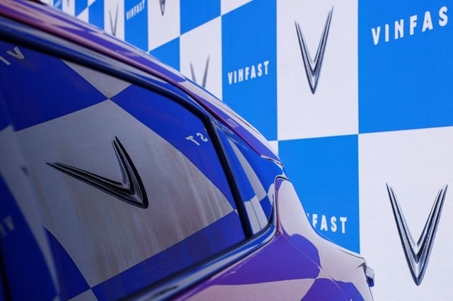 The reflection of the VinFast logo is seen on a car's window during India's five-day auto show in New Delhi, India, January 18, 2025. REUTERS/Priyanshu Singh/File Photo