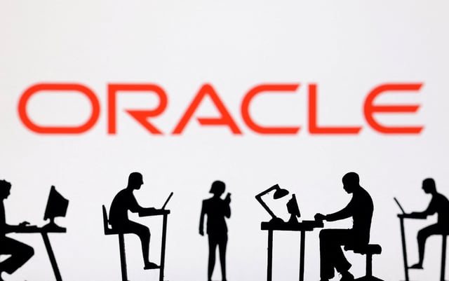 Figurines with computers and smartphones are seen in front of Oracle logo in this illustration taken, February 19, 2024. REUTERS/Dado Ruvic/Illustration