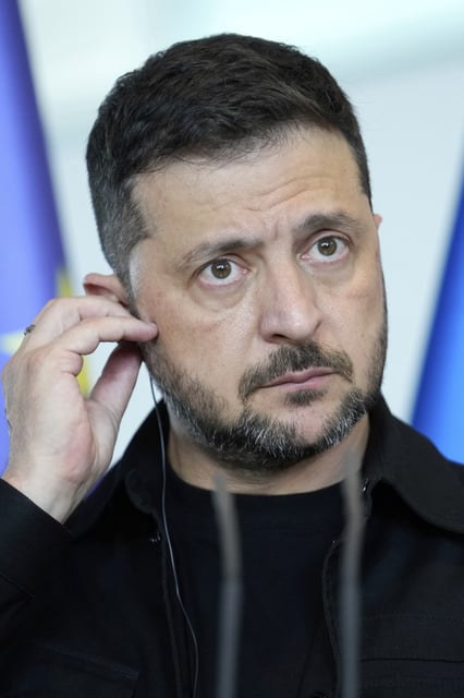 Ukrainian President Volodymyr Zelenskyy attends a joint press statement with German Chancellor Friedrich Merz following talks with European and U.S. leaders in Berlin, Germany, Wednesday, Aug. 13, 2025. (AP Photo/Ebrahim Noroozi)
