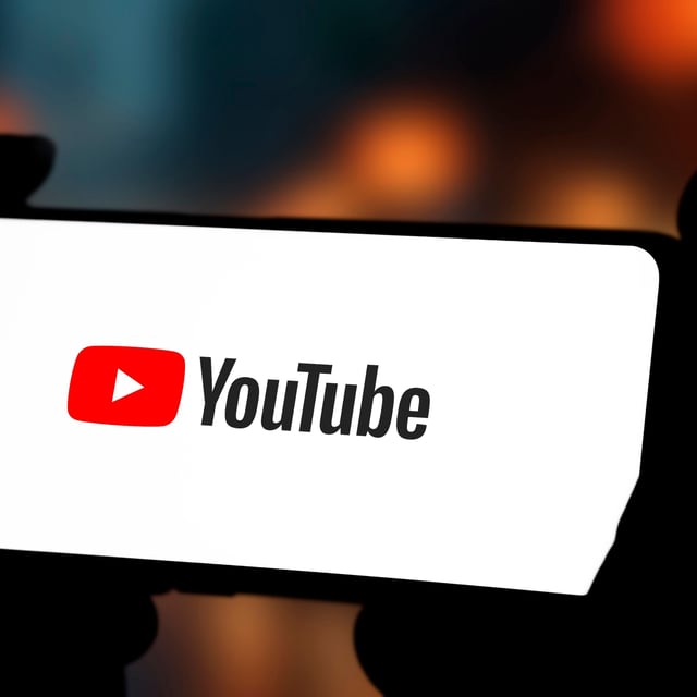 A landscape smartphone with the YouTube logo 