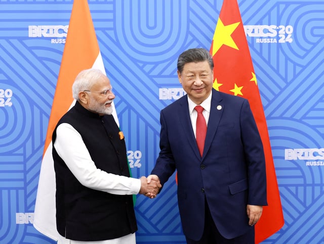 Chinese President Xi Jinping and India Prime Minister Narendra Modi meet on the sidelines of the BRICS summit in Kazan, Russia October 23, 2024. China Daily via REUTERS/File Photo