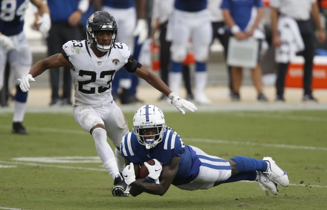 Sep 13, 2020; Jacksonville, Florida, USA;  Indianapolis Colts wide receiver Parris Campbell (15) dives for the ball as Jacksonville Jaguars cornerback C.J. Henderson (23) closes in during the second half at TIAA Bank Field. Mandatory Credit: Reinhold Matay-USA TODAY Sports/File Photo