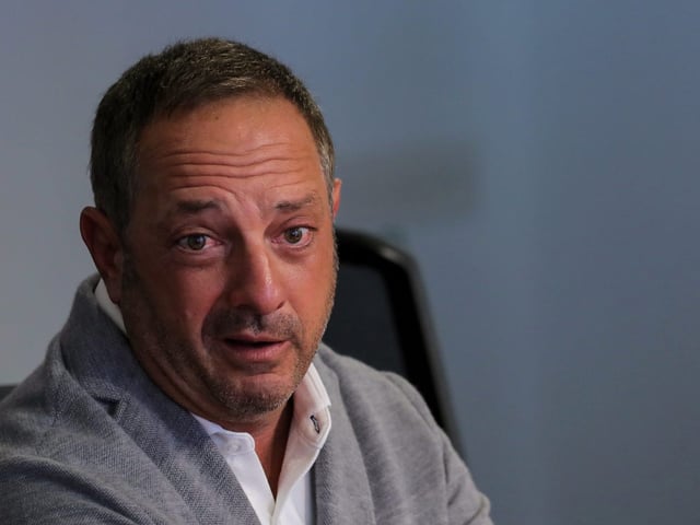 FILE PHOTO: Andrew Left, the founder of Citron Research, speaks during the Reuters Global Investment 2019 Outlook Summit, in New York