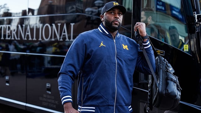 Michigan head coach Sherrone Moore walks off the bus during team arrival before the Michigan State game at Michigan Stadium in Ann Arbor on Saturday, Oct. 26, 2024.
