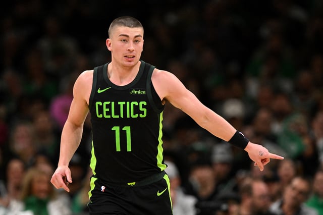 Payton Pritchard #11 of the Boston Celtics watches a play against the Charlotte Hornets during second half at the TD Garden on April 13, 2025 in Boston, Massachusetts.