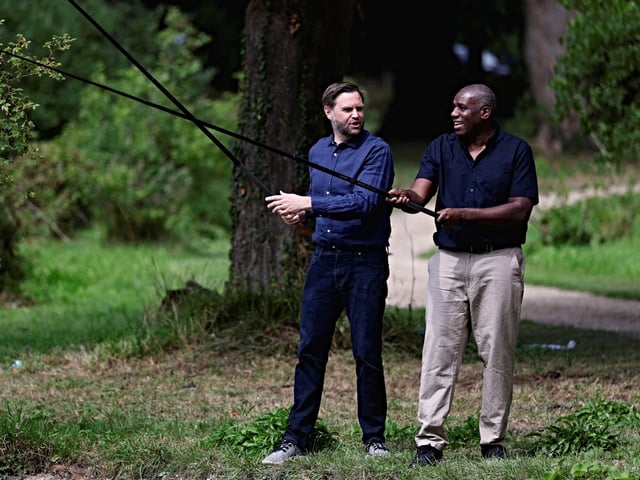 Britain's Foreign Secretary David Lammy (R) and US Vice President JD Vance (L) fish in the grounds of Chevening House, in Chevening, southeast England, on August 8, 2025. Lammy is hosting the US vice president and his family throughout the weekend for a private holiday at his country retreat in Chevening in Kent. The pair were expected to  discuss shared priorities and the UK-US relationship. (Photo by Suzanne Plunkett / POOL / AFP)