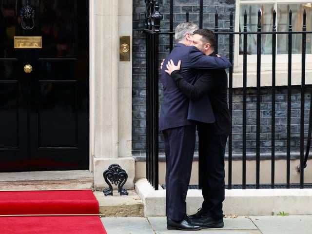 Volodymyr Zelenskiy, Ukraine's president, right, arrives for a meeting with Keir Starmer, UK prime minister, at 10 Downing Street in London, UK, on Thursday, Aug. 14, 2025. US President Donald Trump warned he would impose “very severe consequences” if Vladimir Putin didn’t agree to a ceasefire agreement later this week, following a call with European leaders ahead of his meeting with the Russian president. Photographer: Jason Alden/Bloomberg