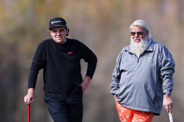 ORLANDO, FLORIDA - DECEMBER 18: John Daly of the United States and son Little John Daly Jr. of the United States look on from the 12th green during the final round of the PNC Championship at Ritz-Carlton Golf Club on December 18, 2022 in Orlando, Florida. (Photo by Mike Ehrmann/Getty Images)