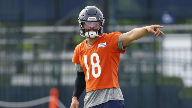 Jul 24, 2025; Lake Forest, IL, USA; Chicago Bears quarterback Caleb Williams (18) signals during training camp at Halas Hall. Mandatory Credit: Kamil Krzaczynski-Imagn Images
