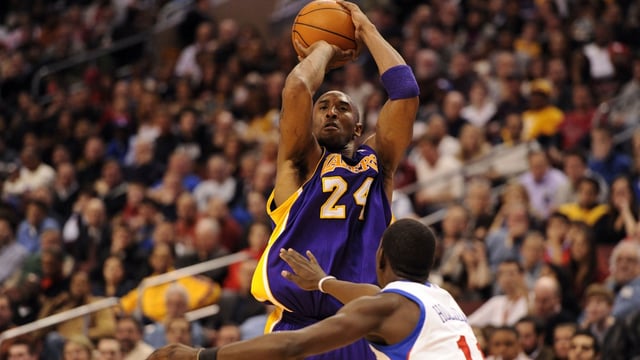Feb 06, 2012; Philadelphia, PA, USA; Los Angeles Lakers guard Kobe Bryant (24) shoots over the defense of Philadelphia 76ers guard Jrue Holiday (11) during the second quarter at the Wells Fargo Center. Mandatory Credit: Howard Smith-Imagn Images