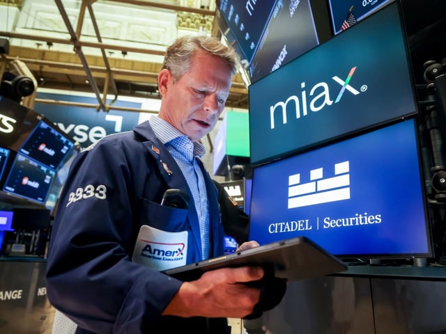 Miami International Holdings (MIAX) signage during the company's initial public offering (IPO) on the floor of the New York Stock Exchange (NYSE) in New York, US, on Thursday, Aug. 14, 2025. Shares in exchange operator Miami International Holdings Inc. are indicated to open at $28 to $30 each, as much as 30% above the initial public offering price of $23 per share. Photographer: Michael Nagle/Bloomberg