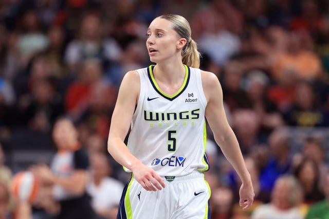 Paige Bueckers #5 of the Dallas Wings looks on against the Indiana Fever during the third quarter at Gainbridge Fieldhouse on August 12, 2025 in Indianapolis, Indiana.