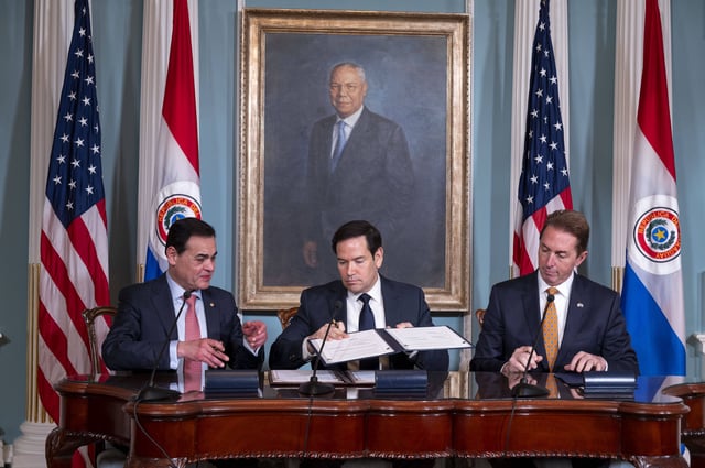 Secretary of State Marco Rubio, center, and Paraguayan Foreign Minister Rubén Ramírez Lezcano, left, exchange documents during a Memorandum of Understanding signing ceremony with Deputy Secretary of Homeland Security Troy Edgar, right, at the State Department, Thursday, Aug. 14, 2025, in Washington.