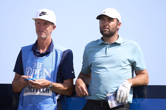 Scottie Scheffler of United States and his caddie Ted Scott look on during a practice round prior to The 153rd Open Championship at Royal Portrush Golf Club on July 16, 2025 in Portrush, Northern Ireland.