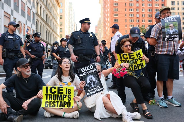 NYPD officers arrest protestors for blocking traffic on Broadway as they protest Immigration and Customs Enforcement (ICE) outside of the Jacob K. Javitz Federal Building on August 08, 2025 in New York City.