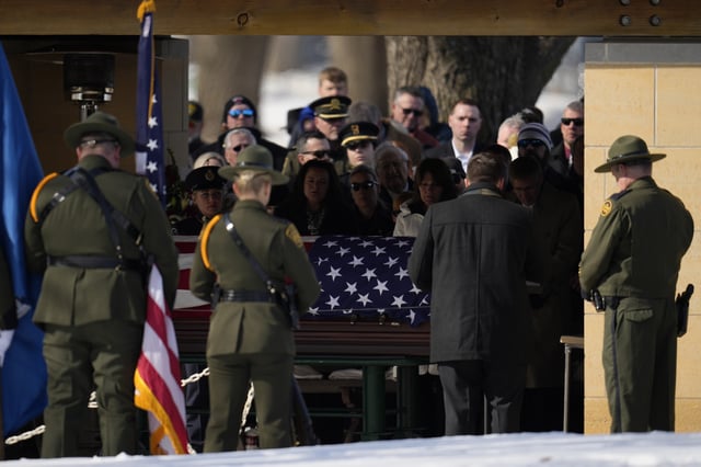 FILE - U.S. Border Patrol agent David Maland is recognized with military honors before his burial at Fort Snelling National Cemetery in Minneapolis, on Feb. 22, 2025. (AP Photo/Abbie Parr, file)