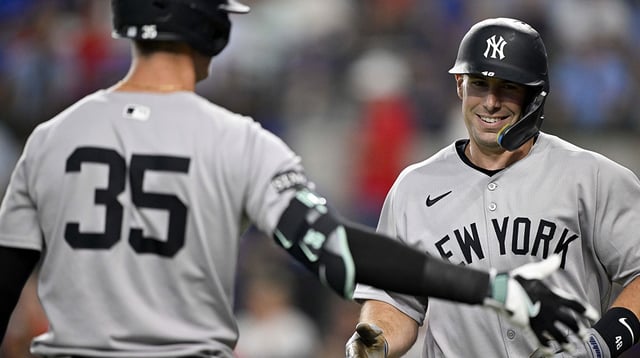 Aug 4, 2025; Arlington, Texas, USA; New York Yankees first baseman Paul Goldschmidt (48) celebrates with center fielder Cody Bellinger (35) after Goldschmidt hits a leadoff home run against the Texas Rangers during the first inning at Globe Life Field. Mandatory Credit: Jerome Miron-Imagn Images