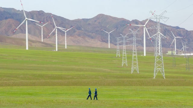 A drone photo shows staff members of State Grid Bortala Electric Power Supply Company patrolling near Sayram Lake scenic area to ensure power supply in Bortala Mongolian Autonomous Prefecture, northwest China&#39;s Xinjiang Uygur Autonomous Region, July 17, 2025.