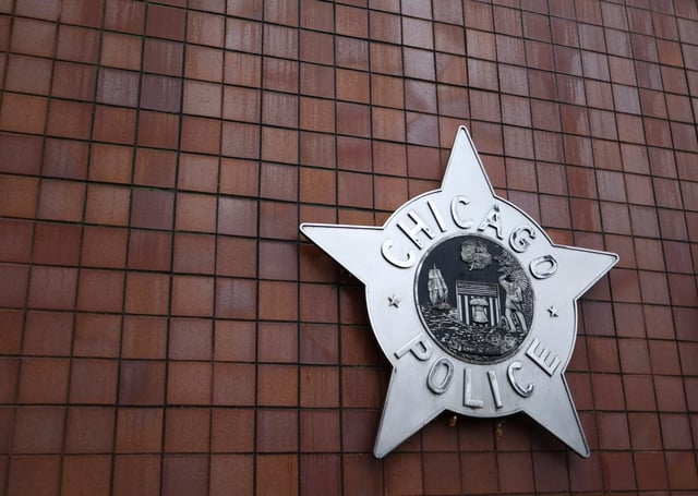 The Chicago Police Department logo hangs on the outside of Chicago Public Safety Headquarters on Dec. 1, 2023. (Talia Sprague/Chicago Tribune)