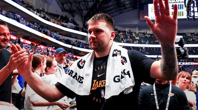 Lakers guard Luka Doncic (77) waves to fans after the game against the Dallas Mavericks at American Airlines Center