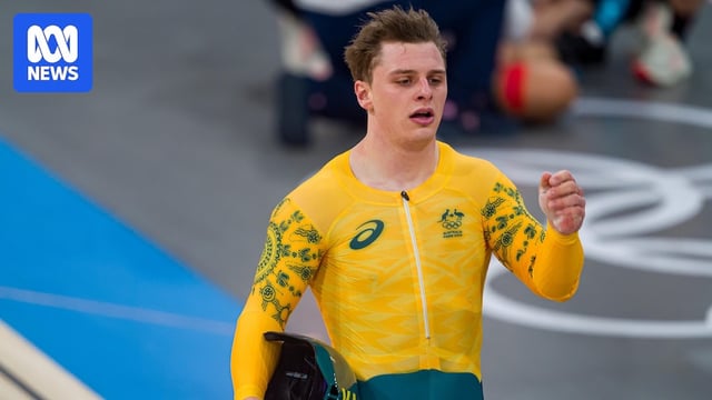 An Australian cyclist reacts after the finish of an Olympic event on the track.