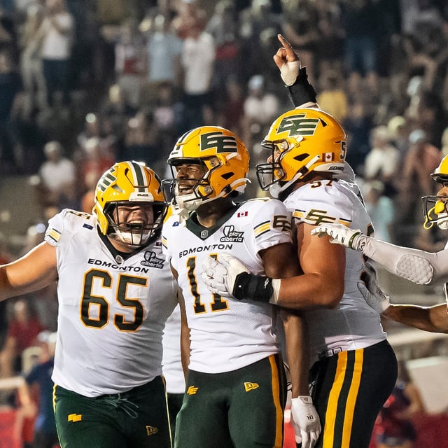 Edmonton Elks' Kaion Julien-Grant (11) celebrates with teammates after he scored during second half CFL action against the Montreal Alouettes in Montreal on Friday, Aug. 8, 2025. THE CANADIAN PRESS/Christopher Katsarov