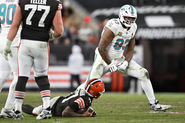 CLEVELAND, OHIO - DECEMBER 29: Calais Campbell #93 of the Miami Dolphins celebrates after tackling Dorian Thompson-Robinson #17 of the Cleveland Browns during the third quarter at Huntington Bank Field on December 29, 2024 in Cleveland, Ohio
