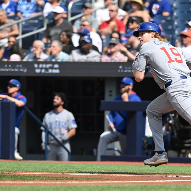 Chicago Cubs designated hitter Owen Caissie (19) hits a flyout in his major-league debut against the Blue Jays in MLB action in Toronto on Thursday, Aug. 14, 2025. THE CANADIAN PRESS/Jon Blacker