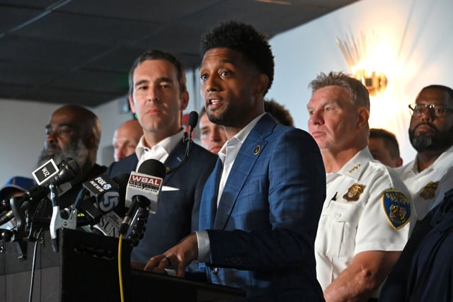 Mayor Brandon Scott, City Council President Zeke Cohen, Police Commissioner Richard Worley and other officials announce the expansion of the city’s Group Violence Reduction Strategy in Cherry Hill.