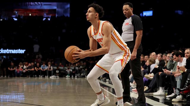 Apr 10, 2025; Brooklyn, New York, USA; Atlanta Hawks forward Zaccharie Risacher (10) sets for a three point shot against the Brooklyn Nets during the fourth quarter at Barclays Center. Mandatory Credit: Brad Penner-Imagn Images