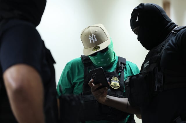 Federal agents patrol the halls of immigration court at the Jacob K. Javitz Federal Building on August 14, 2025 in New York City.