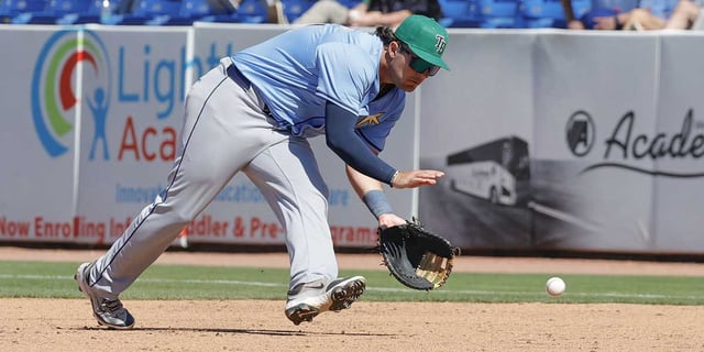 Mar 17, 2025; Port St. Lucie, Florida, USA; Tampa Bay Rays first baseman Bob Seymour fields a ground ball during the ninth inning against the New York Mets at Clover Park. Mandatory Credit: Reinhold Matay-Imagn Images.