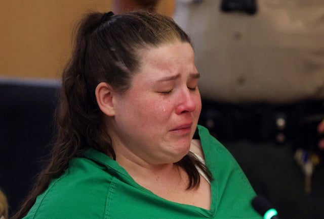 Brittney Lyon, 31, right, who plead guilty to child molestation-related charges, cries during her sentencing at the Vista Courthouse on Thursday. (Hayne Palmour IV / For The San Diego Union-Tribune)