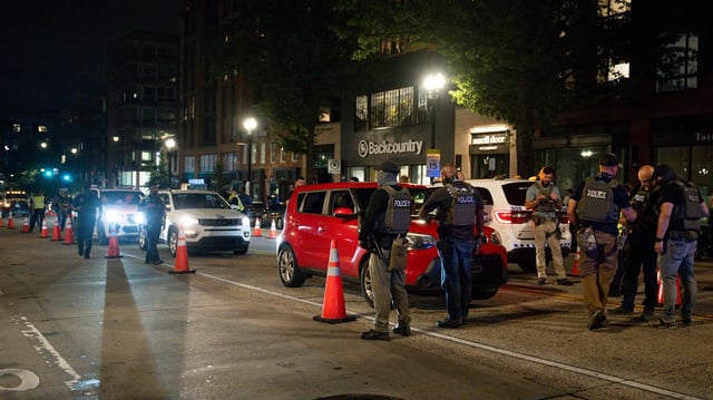 Law enforcement officers at a security checkpoint on 14th Street in Washington, D.C., on Aug. 13. Photo: Kayla Bartkowski/Bloomberg via Getty Images