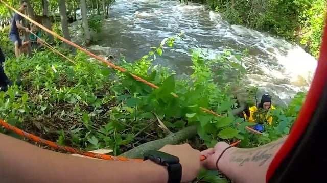 Menomonee Falls first responders rescue two men from a raging river in Wisconsin. 
